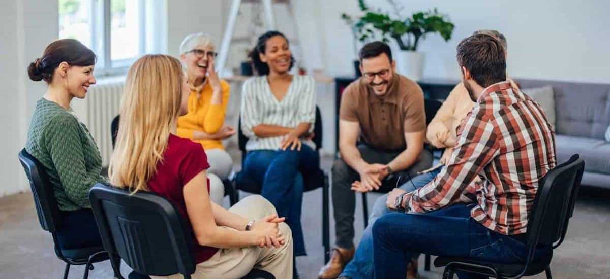 People sharing valuable experiences during a group therapy session at rehab in Chattanooga, TN.