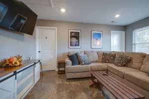Sober living home living room space with comfortable couches and TV in Tennessee