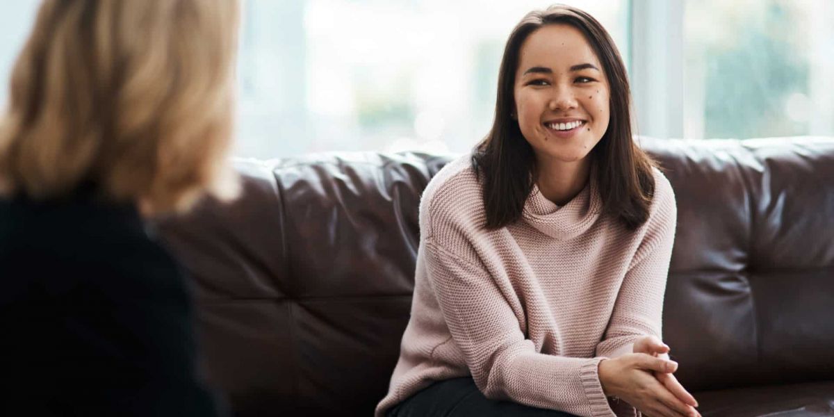 women smiling during therapy session for her drug addiction