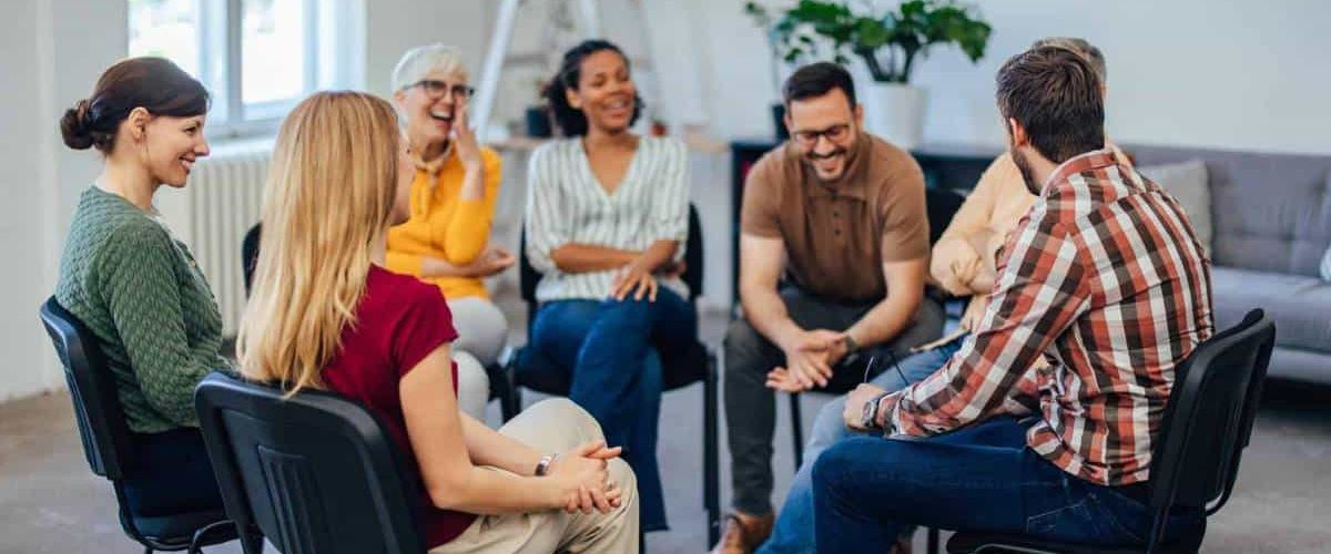 People sharing valuable experiences during a group therapy session at rehab in Chattanooga, TN.