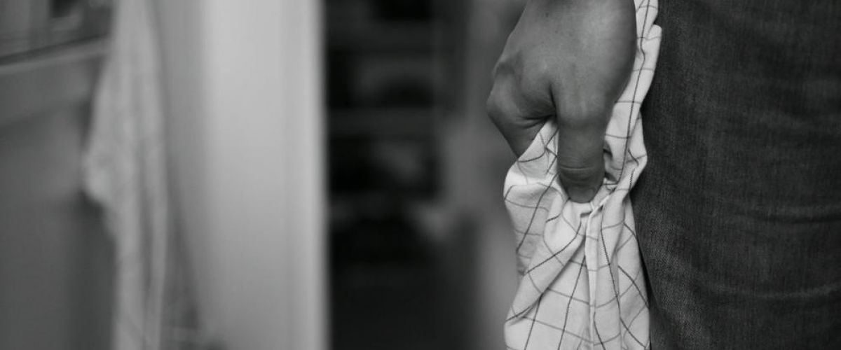 man gripps a towel tightly as he attempts to control his anger