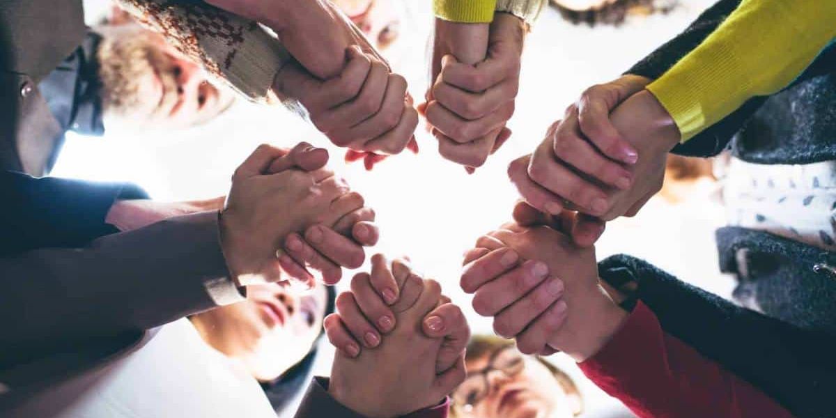 Group of people supporting each other during group therapy at rehab in Chattanooga, TN.