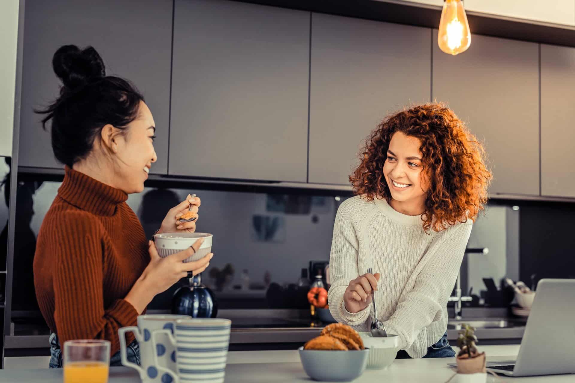 Women having a conversation in the kitchen during sober living in Nashville, TN.