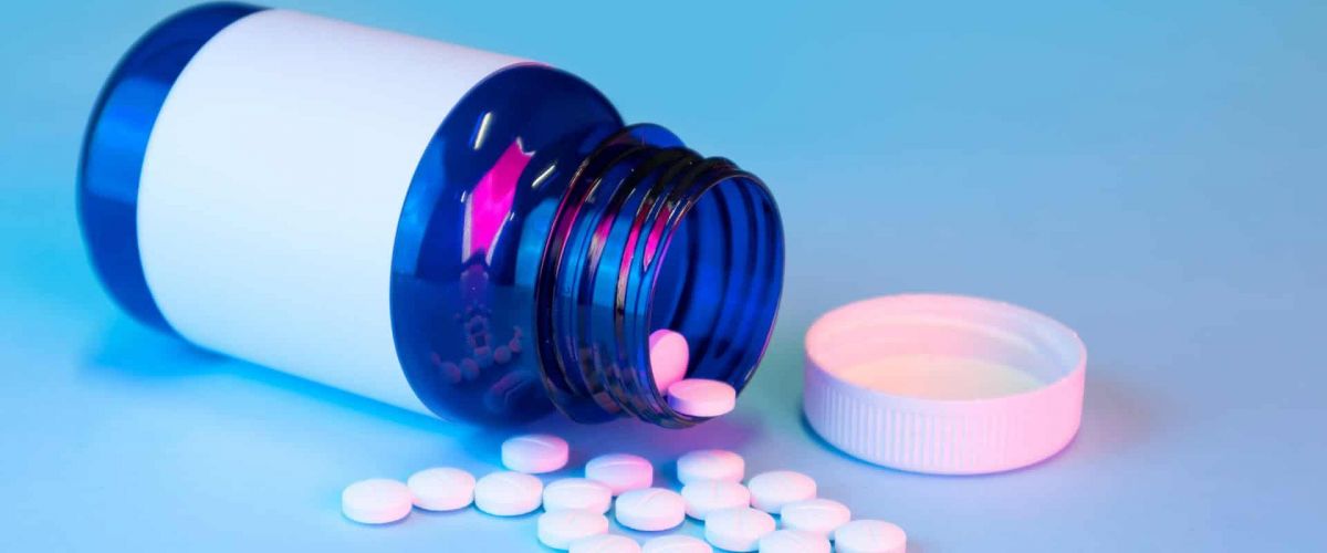 pills spilling out of a pill bottle representing drug addiction detox