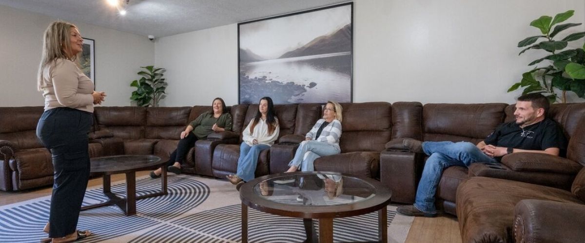 Support group in session as they discuss substance abuse and triggers