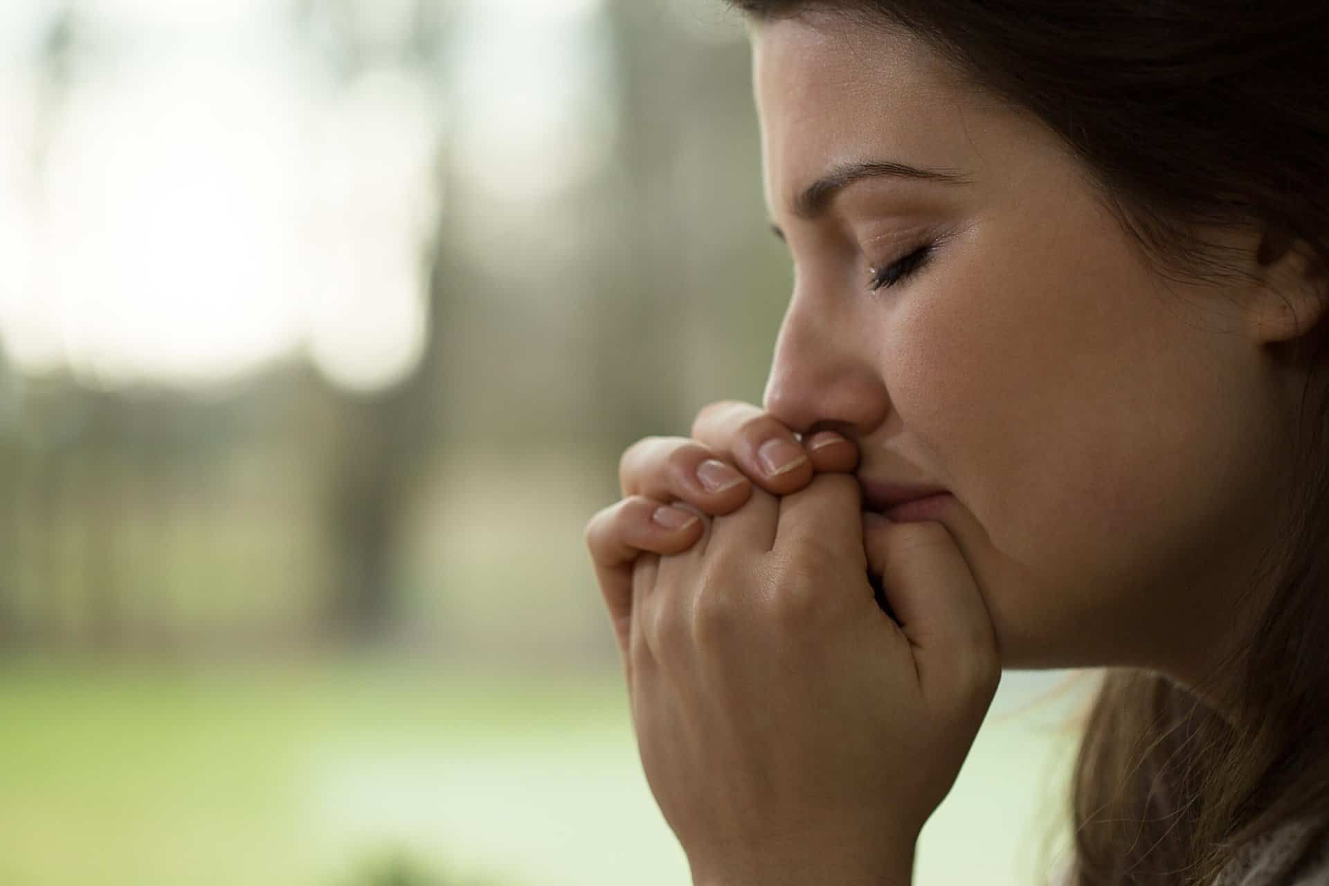 young had her hand up to her face as she struggles with drug addiction