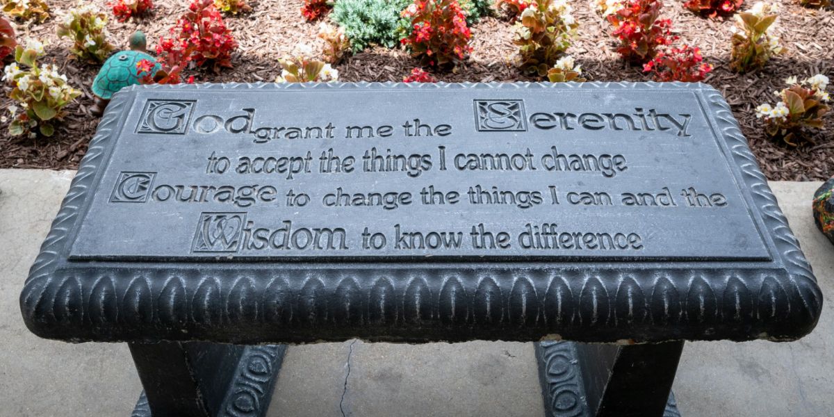 A bench with the serenity prayer in scripted on it