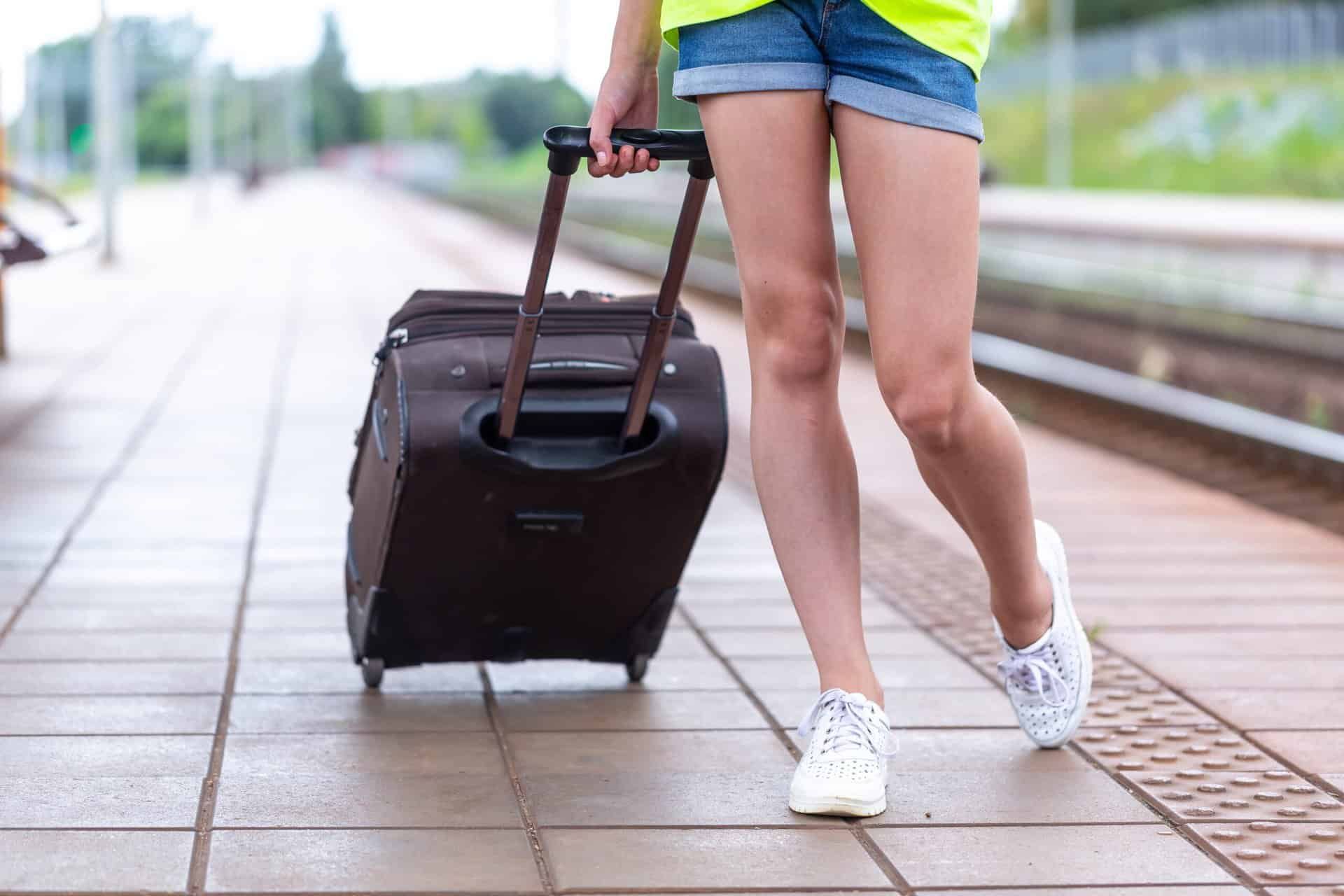 woman with suitcase is leaving rehab early