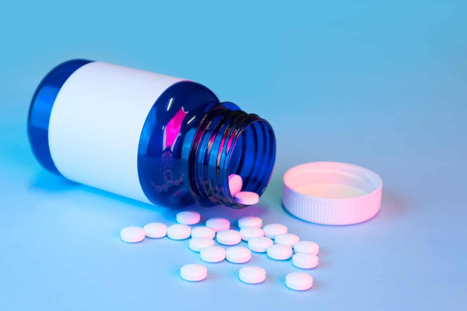 pills spilling out of a pill bottle representing drug addiction detox