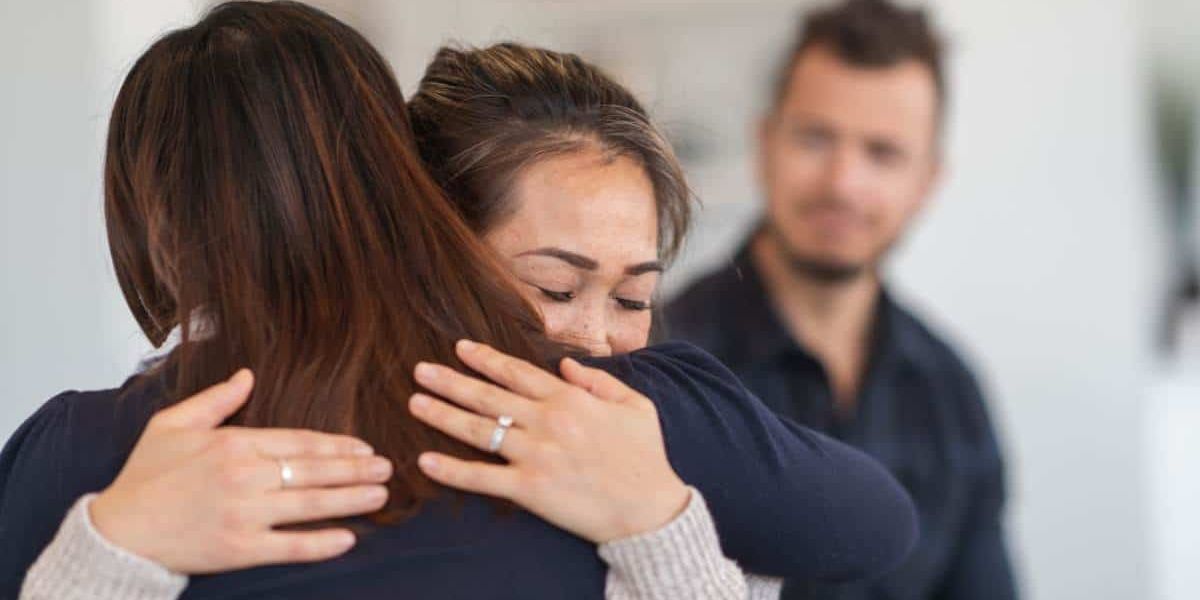 Patient hugging loved one during rehab in Chattanooga, TN.
